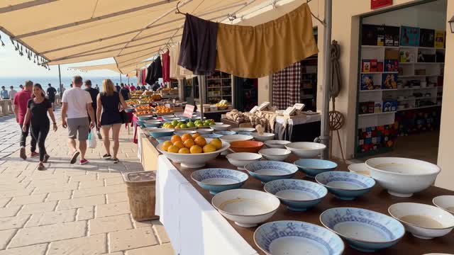 Seaside market stroll featuring local produce on a sunny boardwalk AI video preview